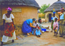 Sister Frances Lorene Lange with mothers and children in Ghana