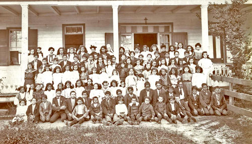 Isle Brevelle, students of St. Joseph School, and Sister Benedict Fenelon, 23 years old