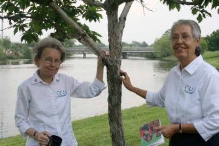 Center for Women in Church and Society organizers Sisters Margit and Maria Eva by a tree in front or Woodlawn Lake